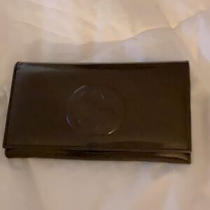 Beautiful Dark Brown Gucci Wallet. Excellent condition. Will add silver chain.